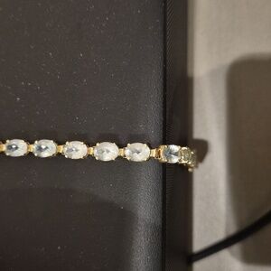 Elegant Gold Bracelet with Light Blue Topaz Stones